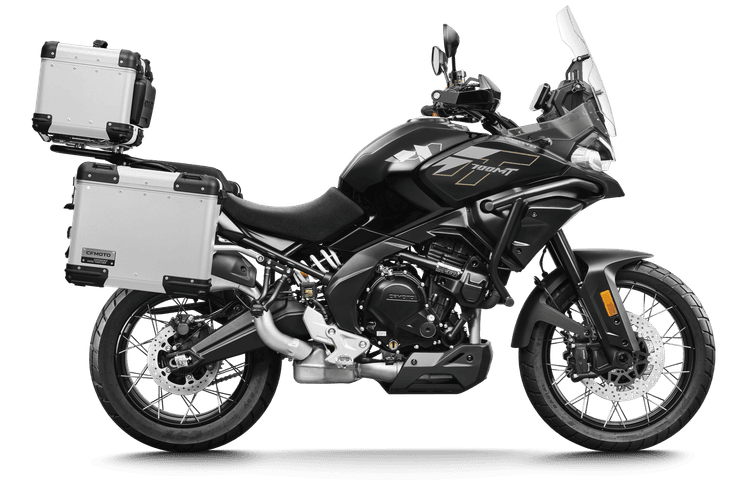 A black adventure motorcycle with silver panniers and a matching top case.
