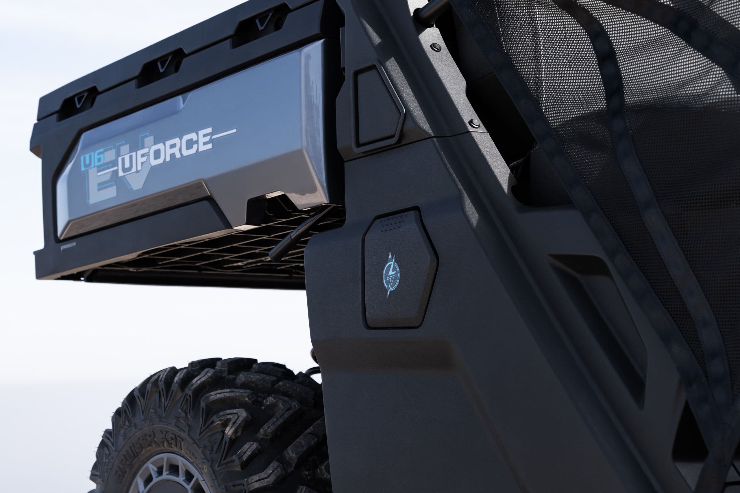 Rear cargo area of a UTV with "E-FORCE" branding visible on the bed.